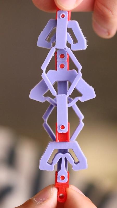 A countersnapping structure, stretched, in its parallel state.